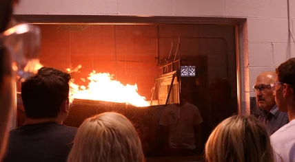 A controlled demonstration showing how air movement can affect fire and smoke travel.