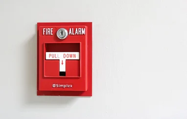A fire alarm is shown as an example of an active fire protection (AFP) product.